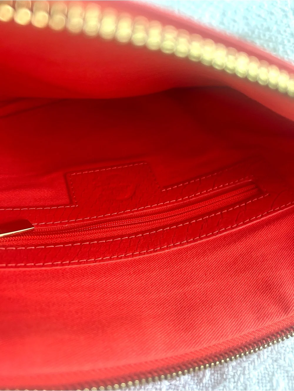 C. Wonder Clutch Orange Red Embossed Print Zip Close with Gold C Emblem